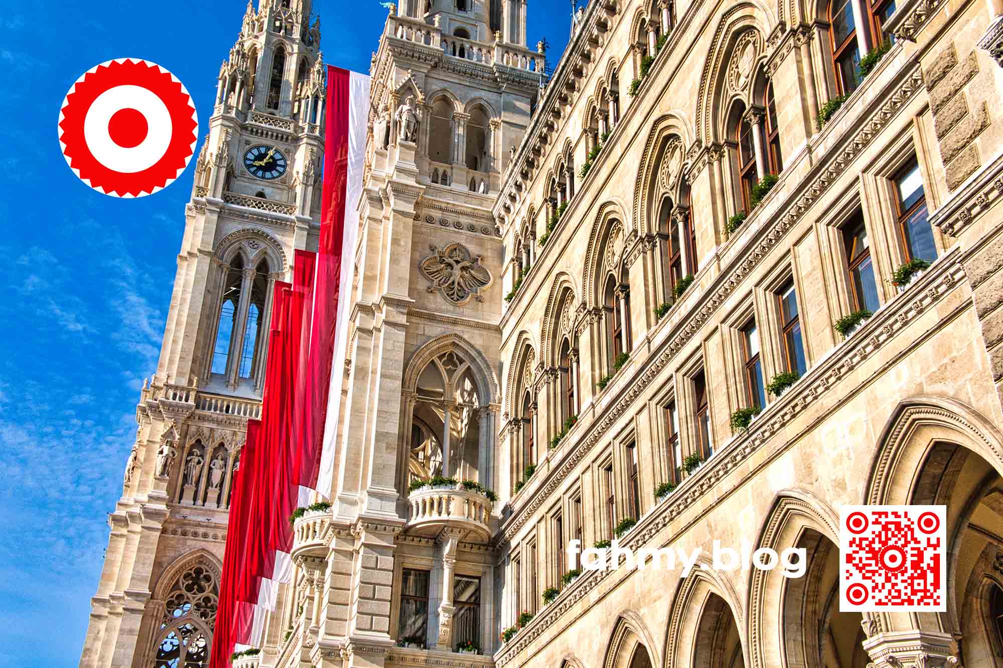 Das Foto vom Wiener Rathaus ist zwar nicht am ersten Mai aufgenommen worden, sondern ein paar Tage später. Es hingen noch die rot-weißen langen Fahnen von der Vorderfassade herab. Der Himmel war strahlend blau. Es war früh morgens: fünf Minuten nach Acht, wie die Rathausuhr zeigt. In der linken oberen Ecke findet sich das rot-weiß-rote Logo von fahmy.blog und in der rechten unteren Ecke der rot-weiße QR-Code und der Schriftzug "fahmy.blog". Das Foto entstand im Mai 2022.